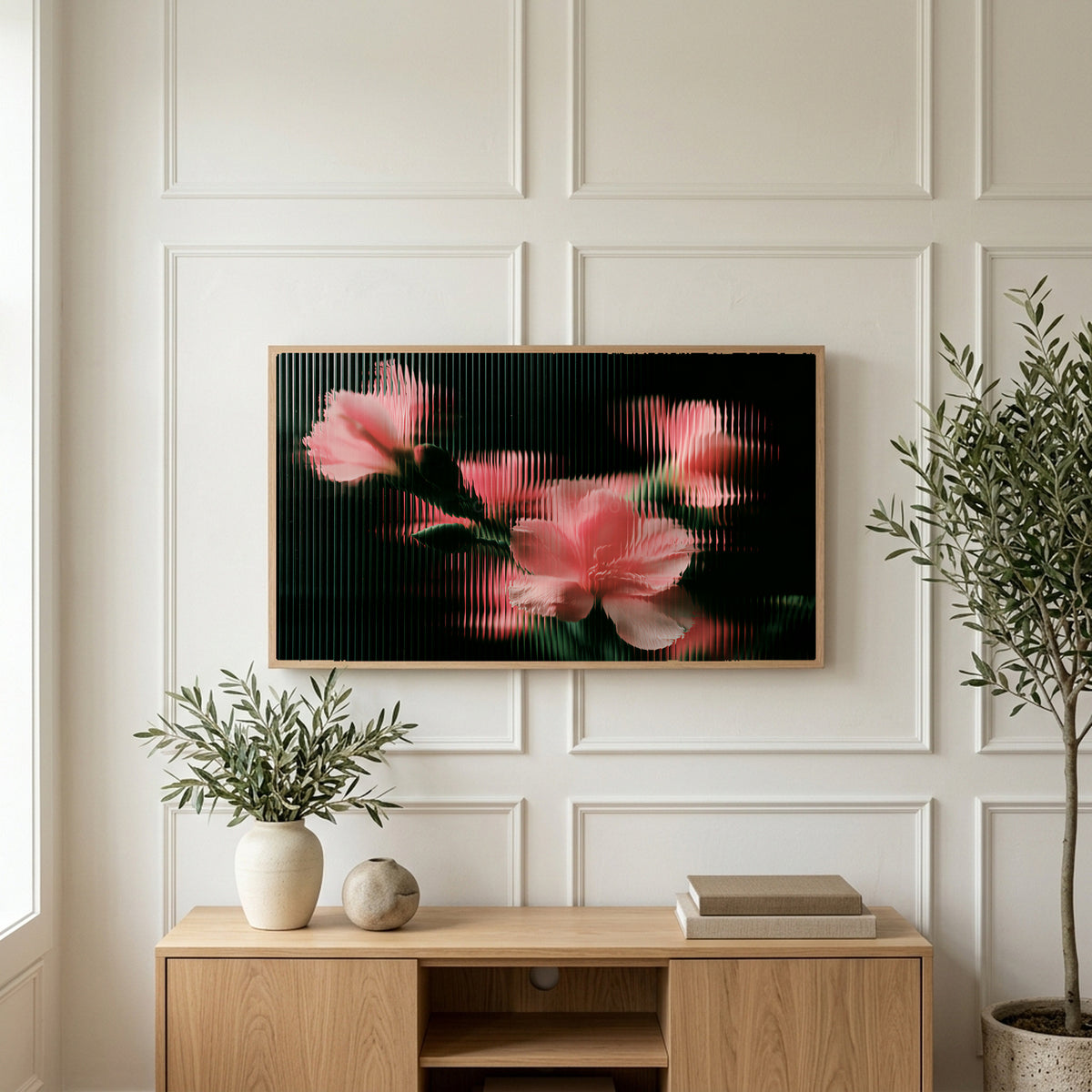 Ribbed glass flowers art on a TV above a light oak sideboard with olive branches in a bright living room