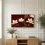Cream blossoms on burgundy art on a TV above a light oak sideboard with olive branches in a bright living room