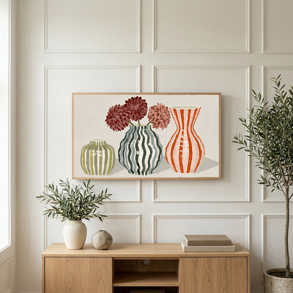 Striped vases art on a TV above a light oak sideboard with olive branches in a bright living room