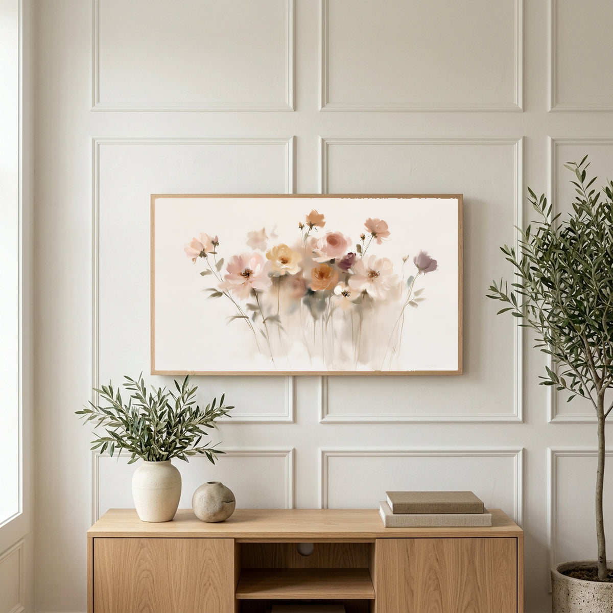 Soft wildflowers art on a TV above a light oak sideboard with olive branches in a bright living room