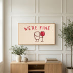 We're Fine wine doodle art on a TV above a light oak sideboard with olive branches in a bright living room