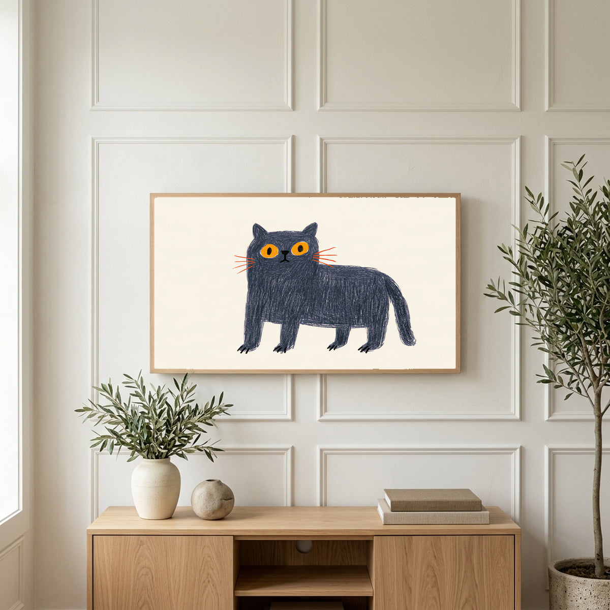 British Blue cat art on a TV above a light oak sideboard with olive branches in a bright living room