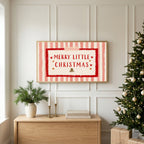 Merry Little Christmas TV art above an oak sideboard next to a decorated Christmas tree