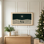 Three wise men TV art above an oak sideboard next to a decorated Christmas tree