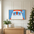 Santa face TV art above an oak sideboard next to a decorated Christmas tree