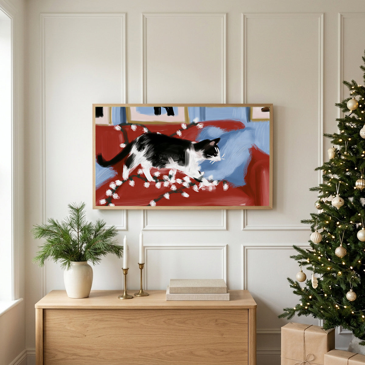 Christmas TV art above an oak sideboard next to a decorated Christmas tree