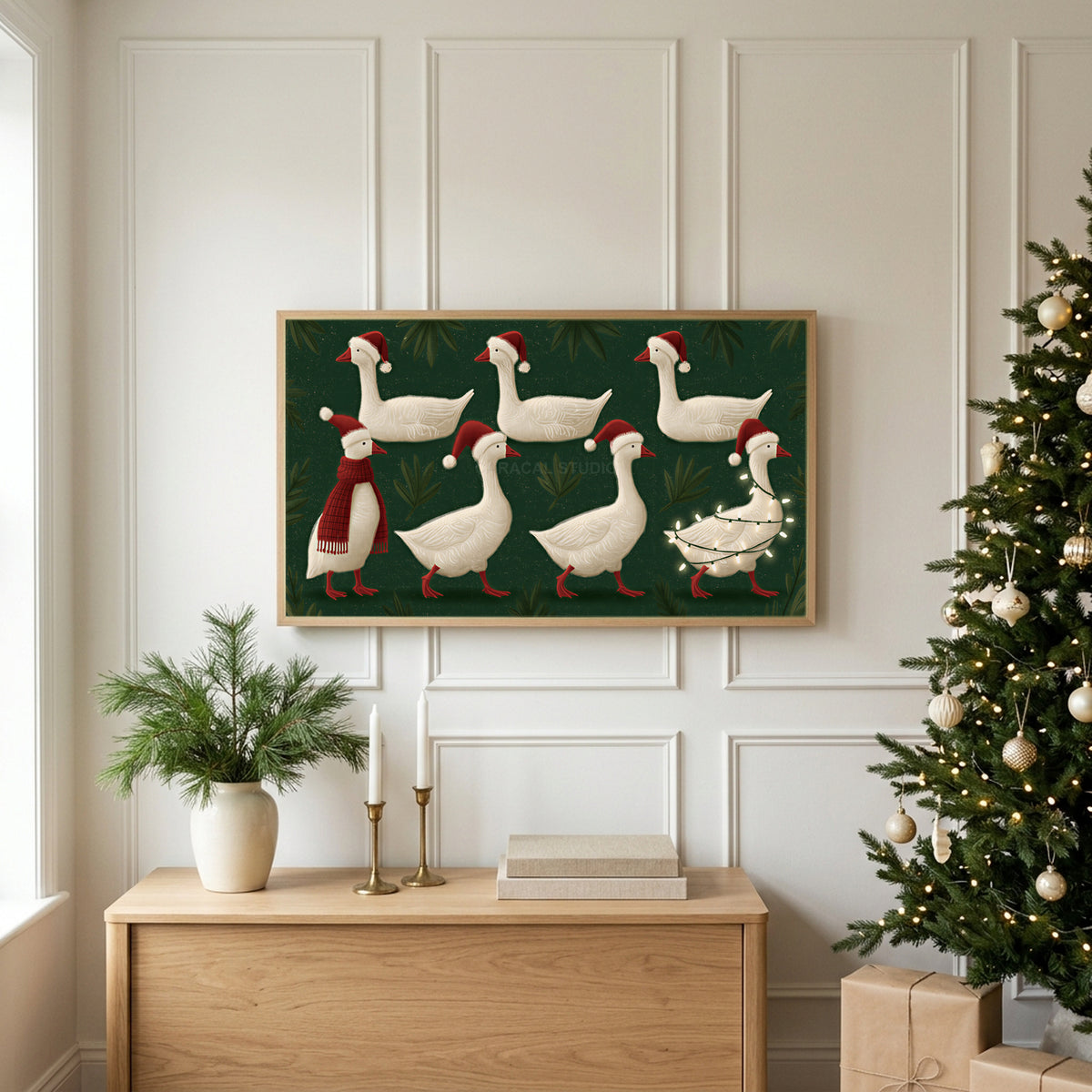 Geese in Santa hats TV art above an oak sideboard next to a decorated Christmas tree