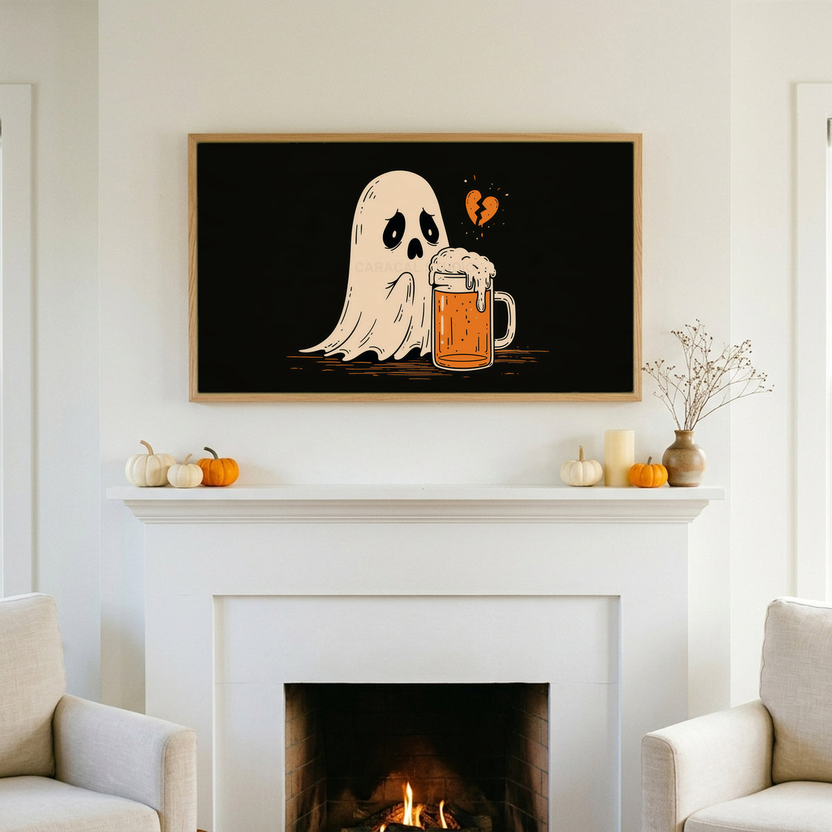 Sad ghost and beer TV art above a white fireplace with small pumpkins on the mantel