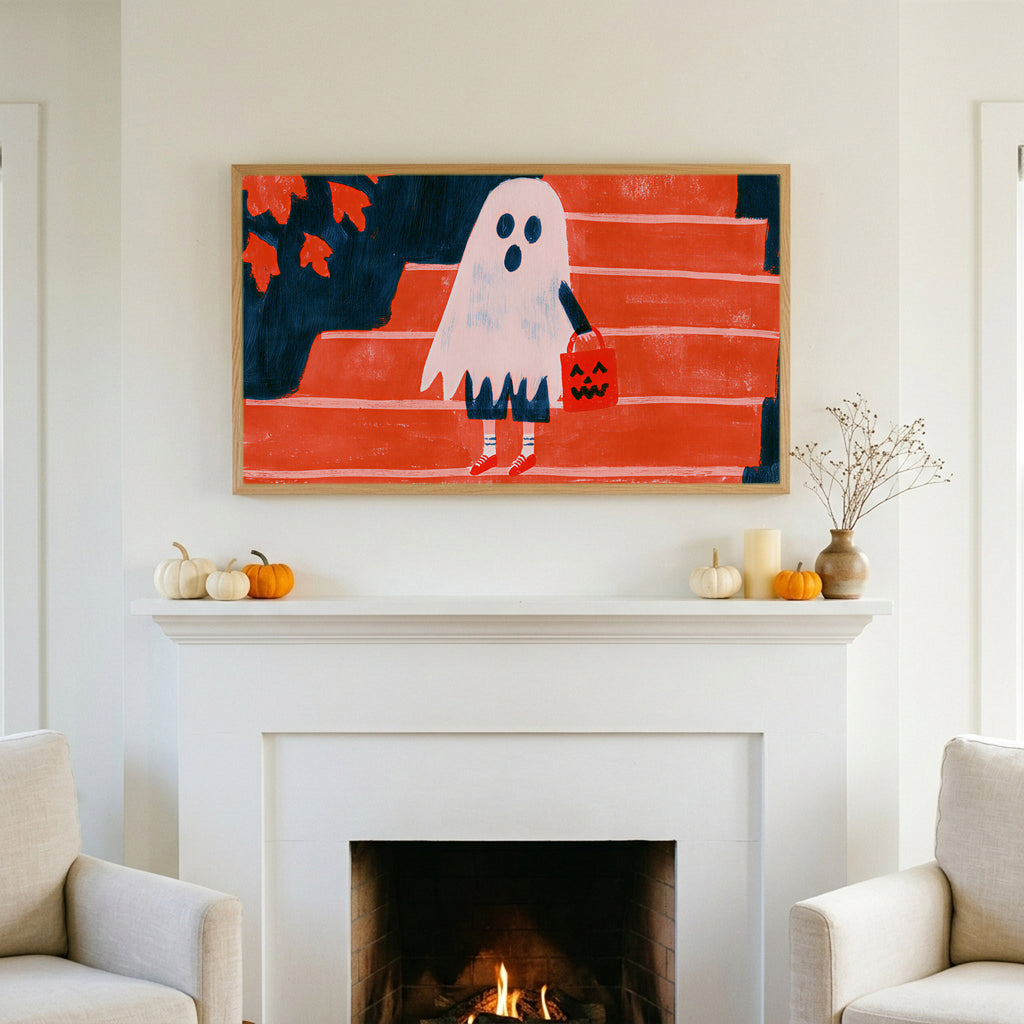 Halloween TV art above a white fireplace with small pumpkins on the mantel