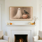 Halloween TV art above a white fireplace with small pumpkins on the mantel