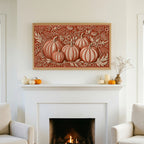 Folk art pumpkins TV art above a white fireplace with small pumpkins on the mantel
