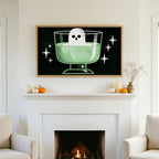 Halloween TV art above a white fireplace with small pumpkins on the mantel