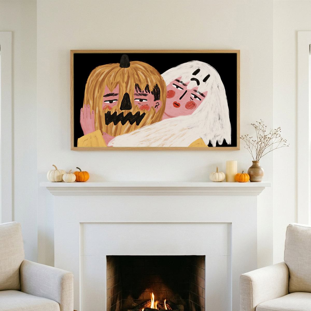 Halloween TV art above a white fireplace with small pumpkins on the mantel