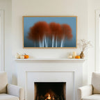 Abstract birch tree TV art above a white fireplace with small pumpkins on the mantel