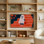 Ghost with a jack-o'-lantern bag art on a TV in built-in oak shelves with pumpkins and books