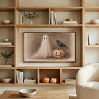Ghost and crow art on a TV in built-in oak shelves with pumpkins and books