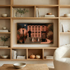 Trick or treat brownstone art on a TV in built-in oak shelves with pumpkins and books