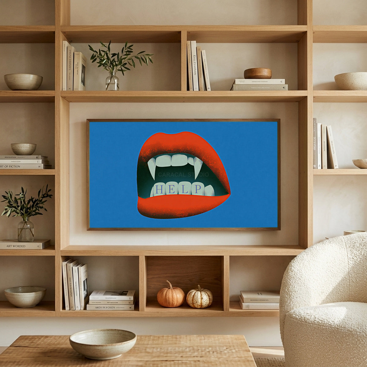 Vampire fangs art on a TV in built-in oak shelves with pumpkins and books