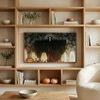 Vampire art on a TV in built-in oak shelves with pumpkins and books