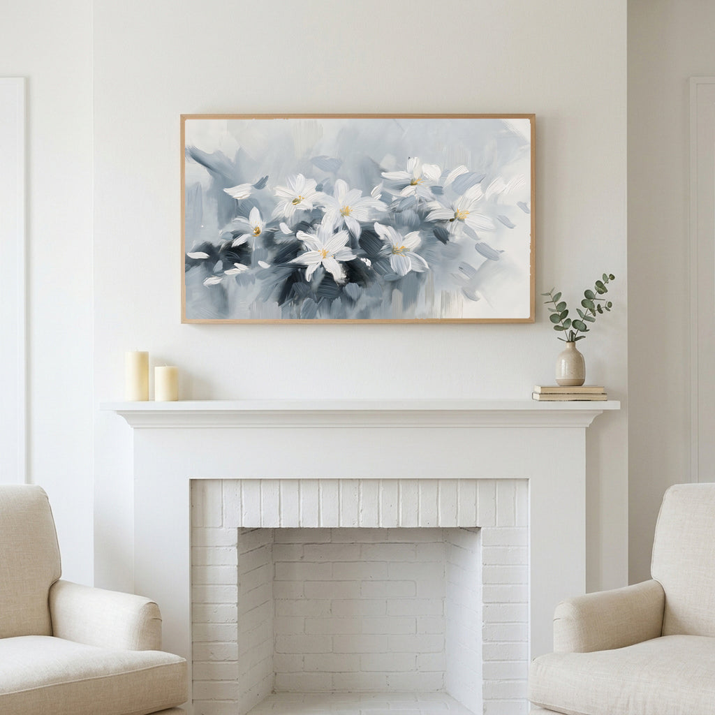 Frame TV art above a white fireplace with candles and eucalyptus on the mantel
