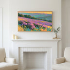 Heather hills art above a white fireplace with candles and eucalyptus on the mantel