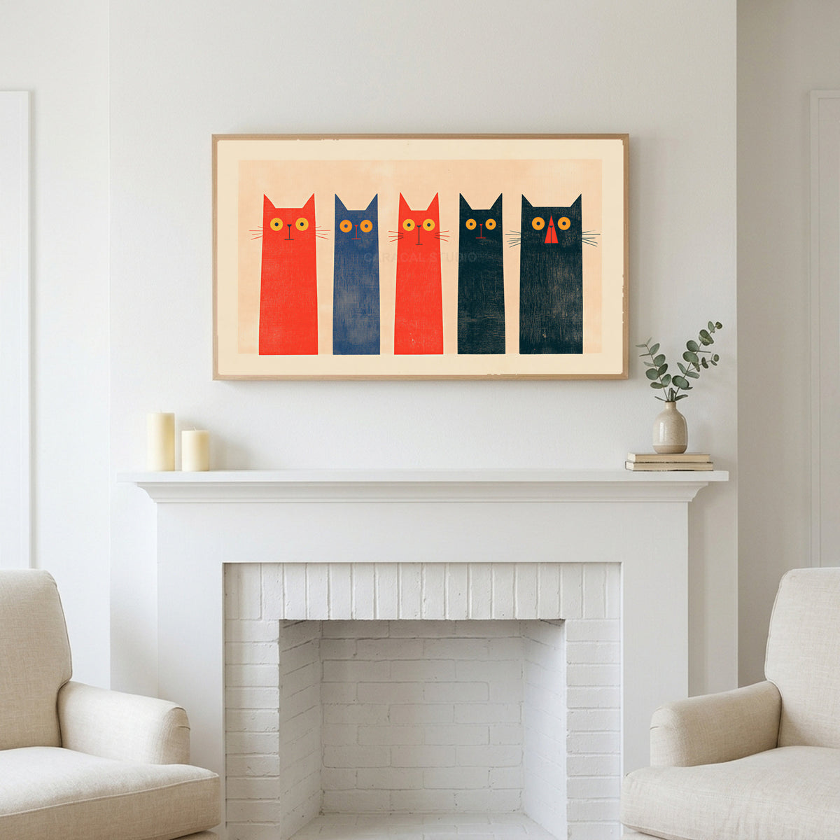 Five tall cats art above a white fireplace with candles and eucalyptus on the mantel