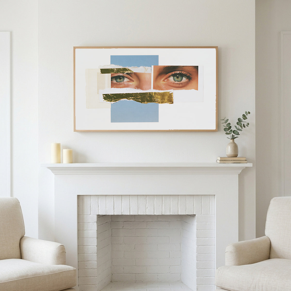 Eye collage art above a white fireplace with candles and eucalyptus on the mantel