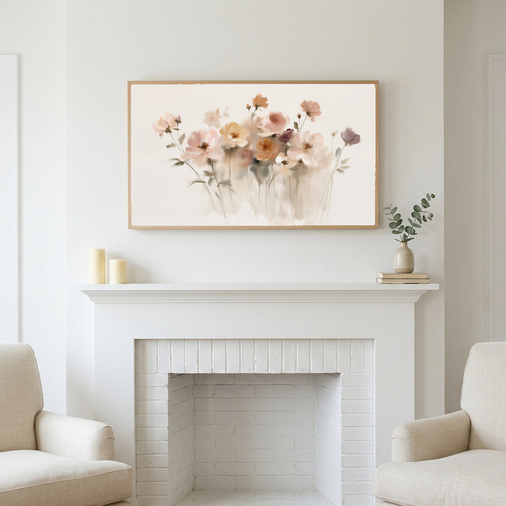 Soft wildflowers art above a white fireplace with candles and eucalyptus on the mantel