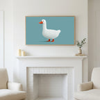 White duck art above a white fireplace with candles and eucalyptus on the mantel