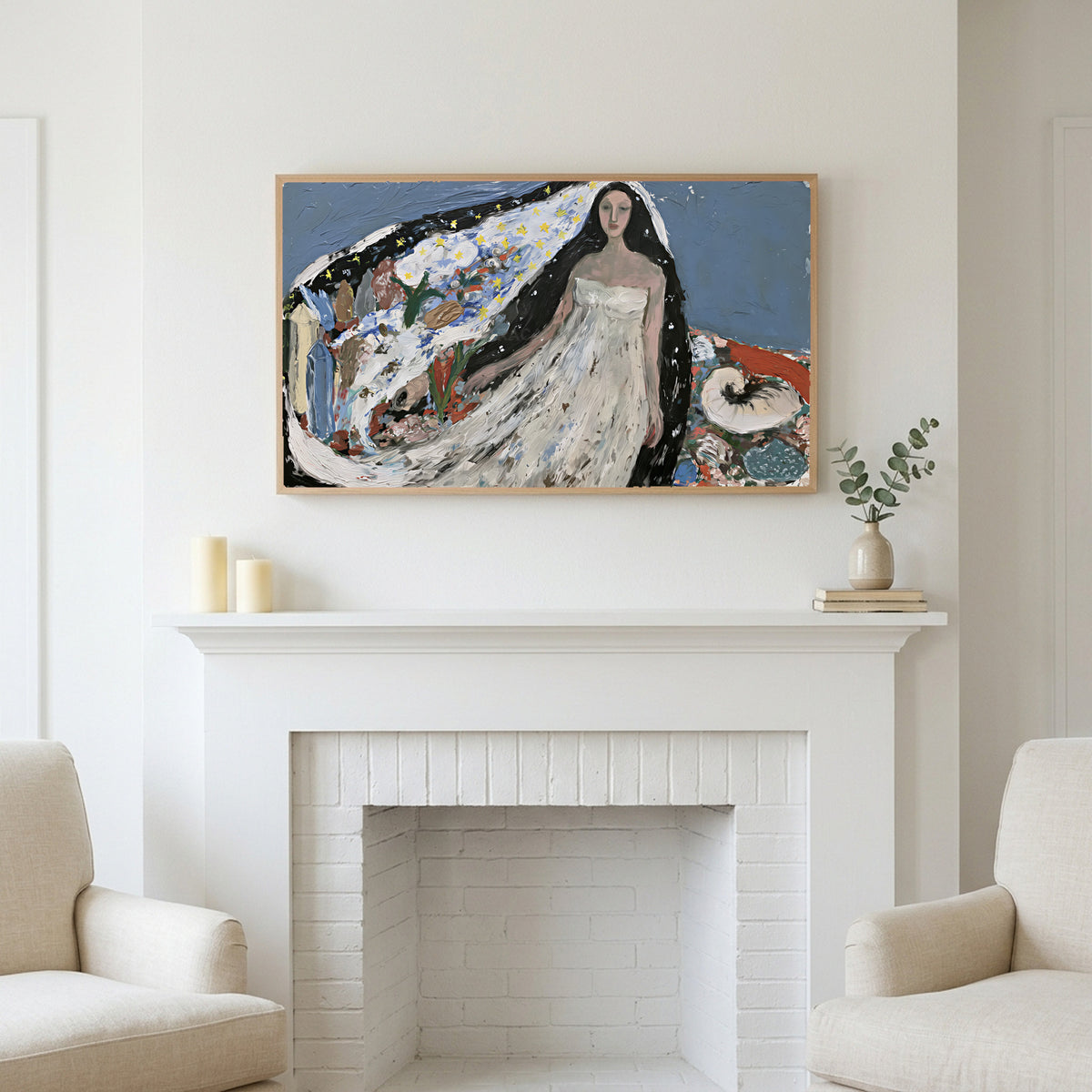 Starry veil woman art above a white fireplace with candles and eucalyptus on the mantel