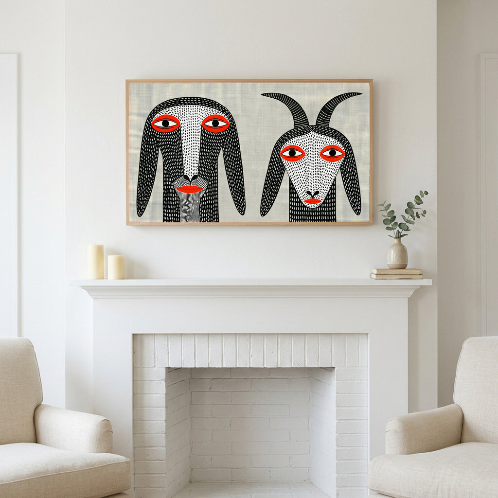 Folk art goats art above a white fireplace with candles and eucalyptus on the mantel