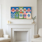 Retro women in sunglasses art above a white fireplace with candles and eucalyptus on the mantel