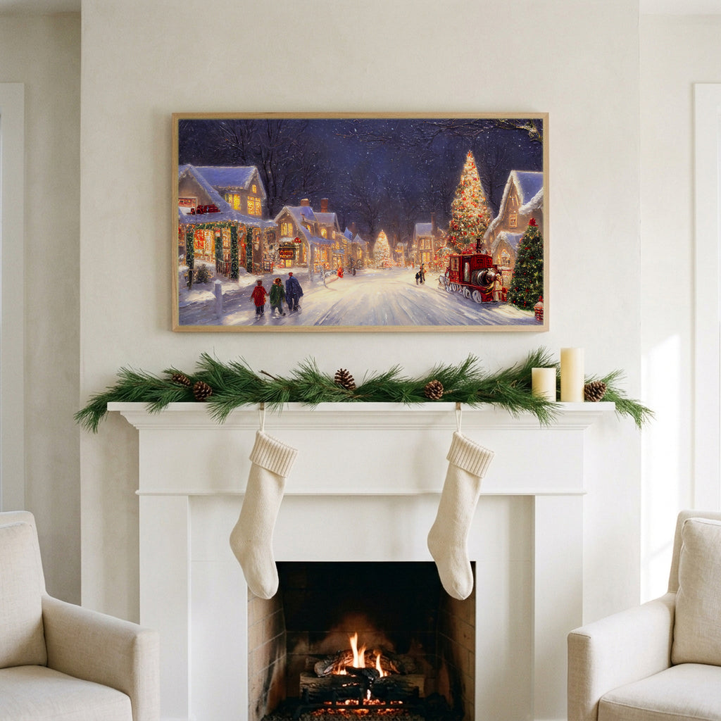 Snowy village with a red truck art on a TV above a white fireplace with a pine garland and cream stockings