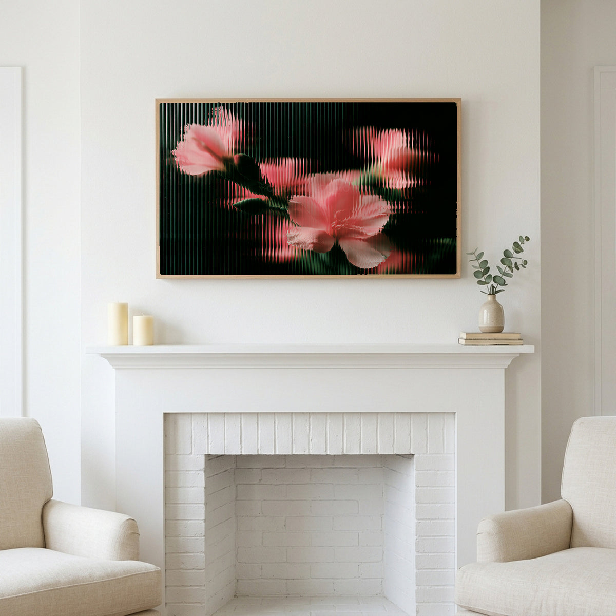 Ribbed glass flowers art above a white fireplace with candles and eucalyptus on the mantel