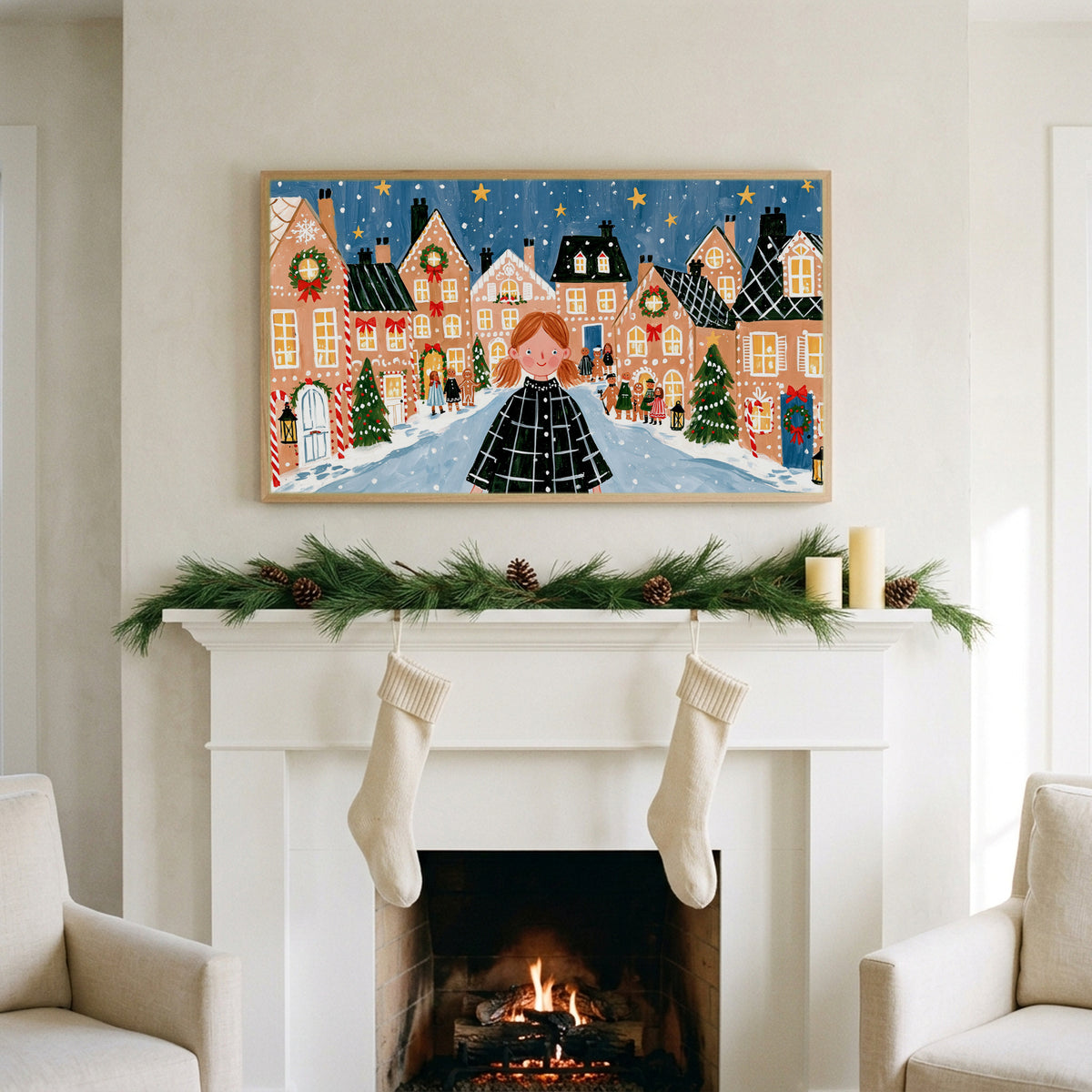 Gingerbread village art on a TV above a white fireplace with a pine garland and cream stockings