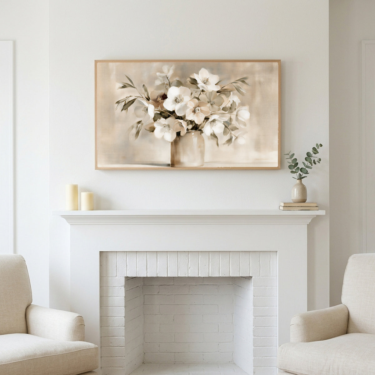 White hellebores art above a white fireplace with candles and eucalyptus on the mantel