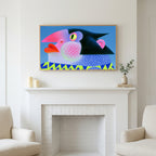 Pop art penguin art above a white fireplace with candles and eucalyptus on the mantel