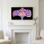 Surreal flower art above a white fireplace with candles and eucalyptus on the mantel