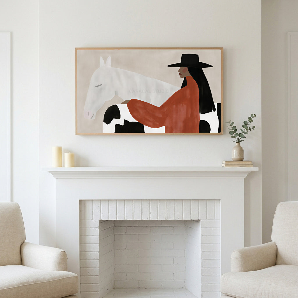 Frame TV art above a white fireplace with candles and eucalyptus on the mantel