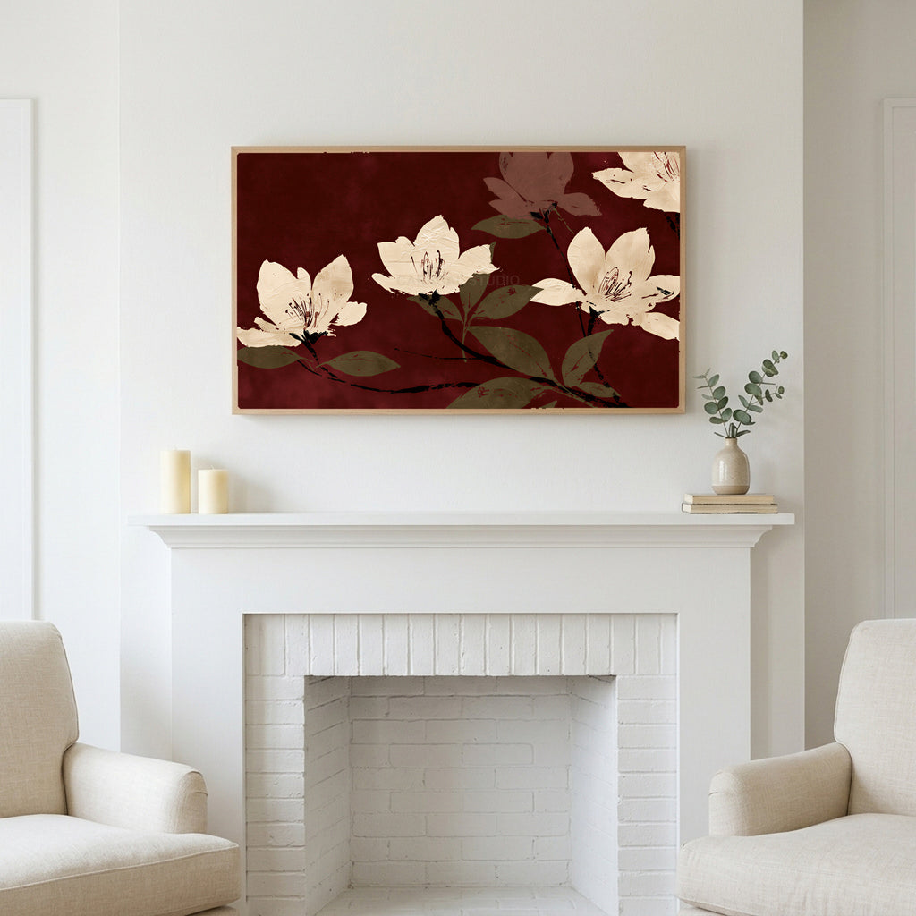 Frame TV art above a white fireplace with candles and eucalyptus on the mantel
