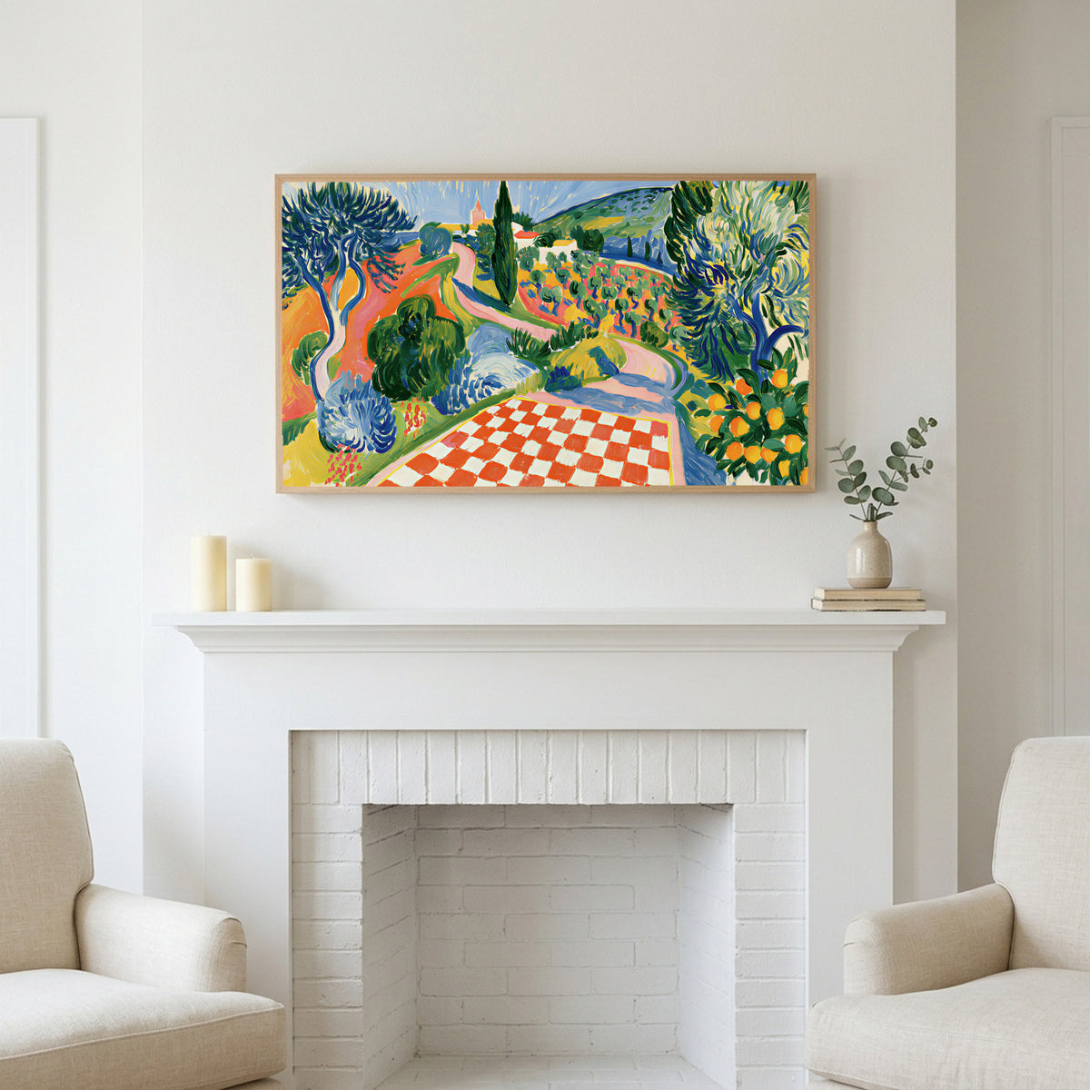 Italian countryside art above a white fireplace with candles and eucalyptus on the mantel