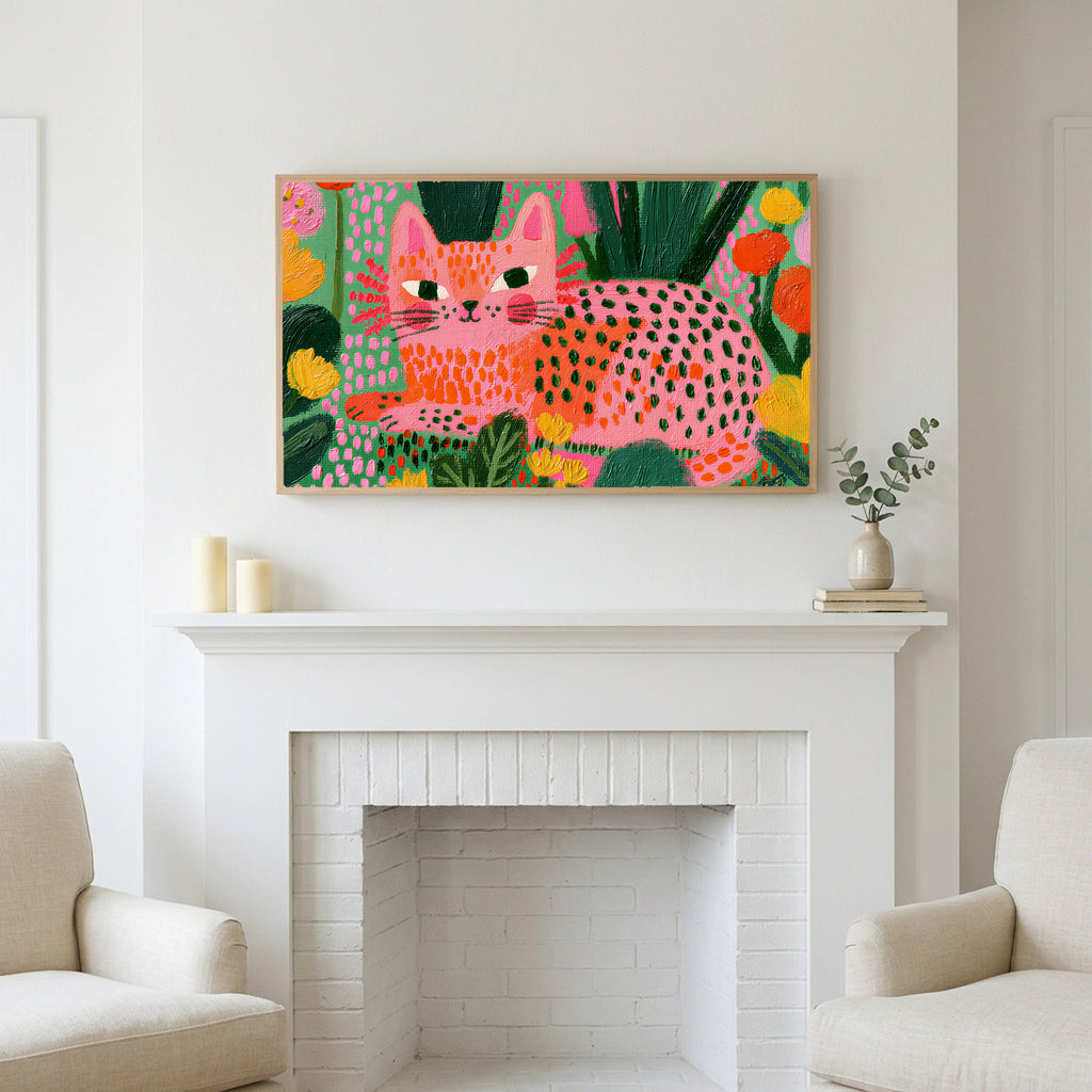Spotted cat art above a white fireplace with candles and eucalyptus on the mantel