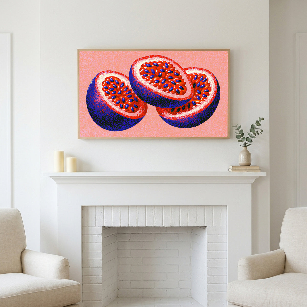 Passion fruit art above a white fireplace with candles and eucalyptus on the mantel