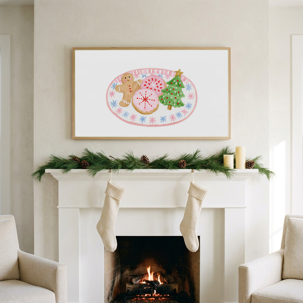 Christmas cookies art on a TV above a white fireplace with a pine garland and cream stockings