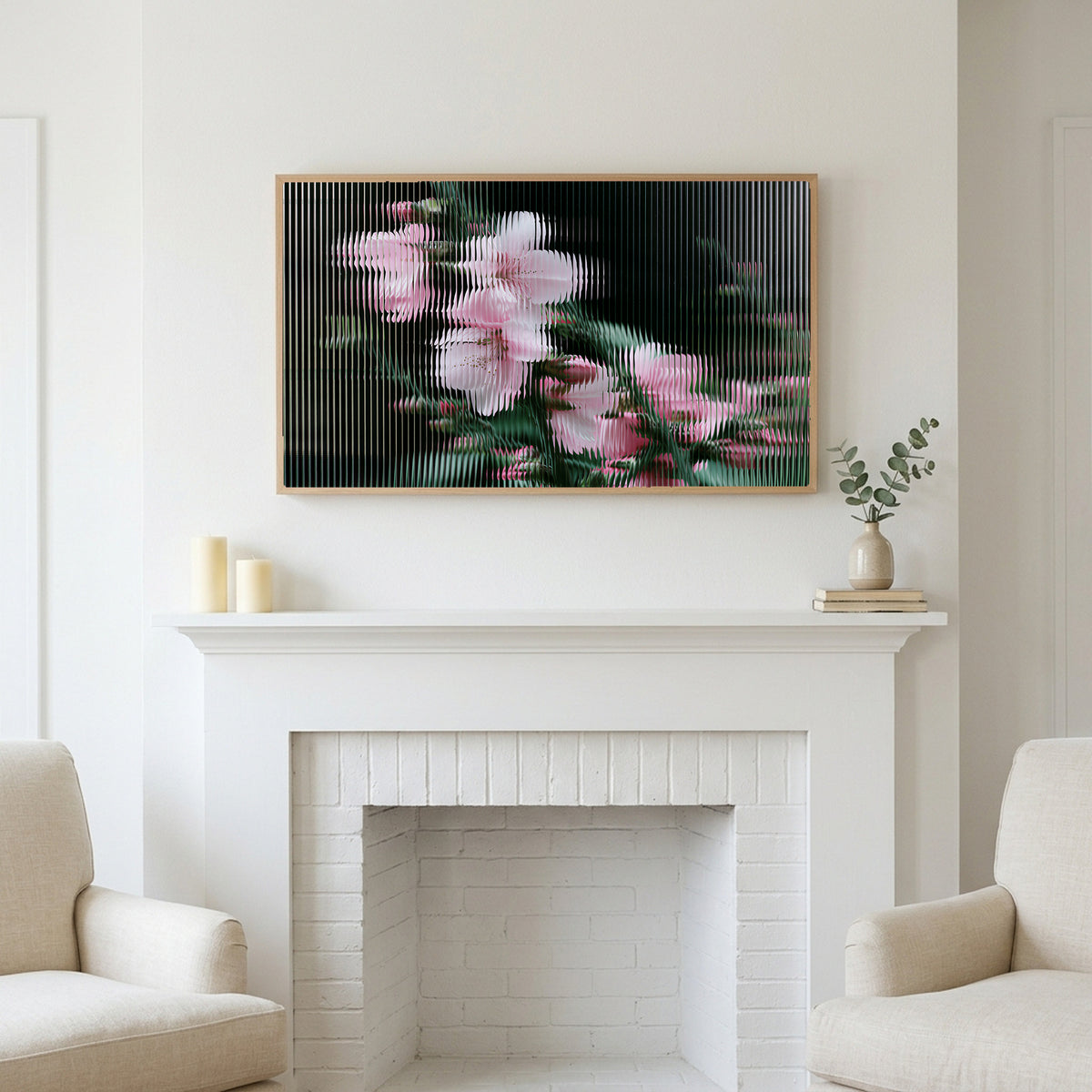 Fluted glass blossom art above a white fireplace with candles and eucalyptus on the mantel