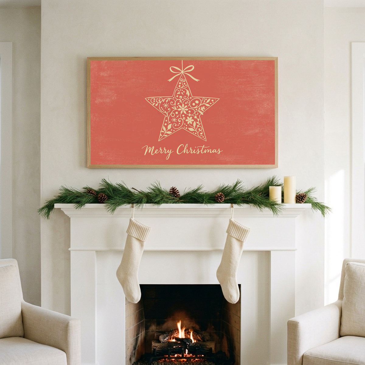 Star ornament art on a TV above a white fireplace with a pine garland and cream stockings