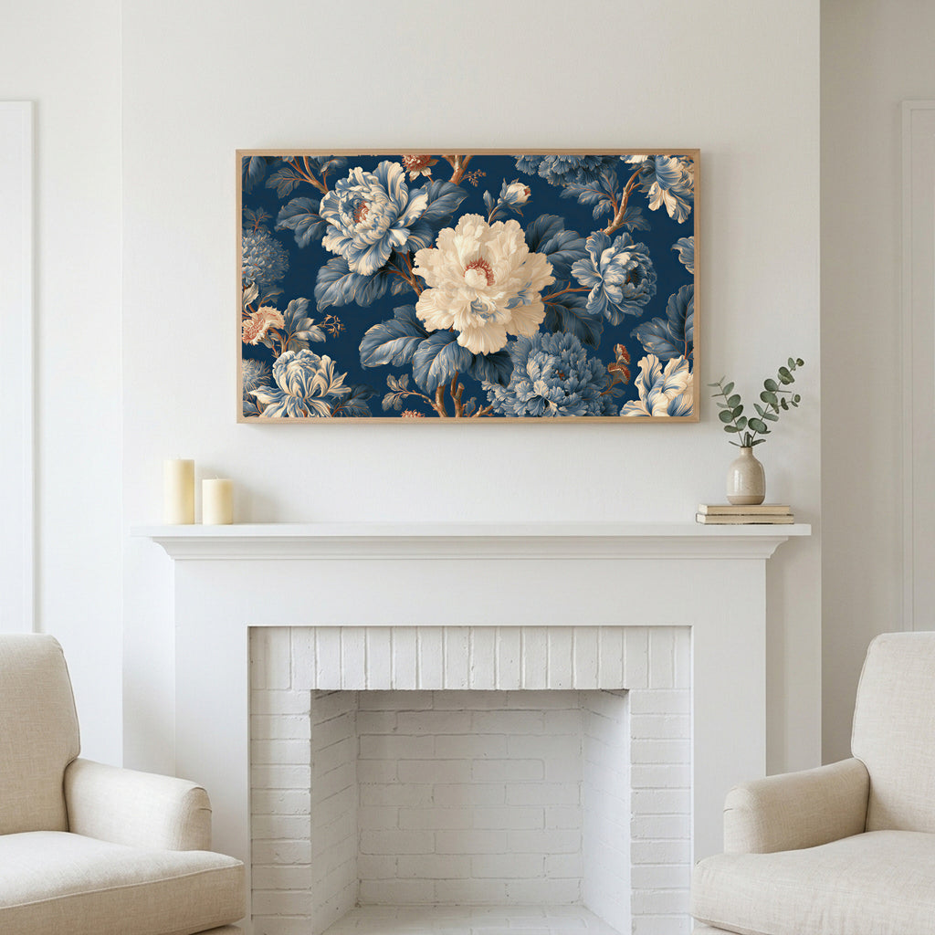 Blue and cream peonies art above a white fireplace with candles and eucalyptus on the mantel