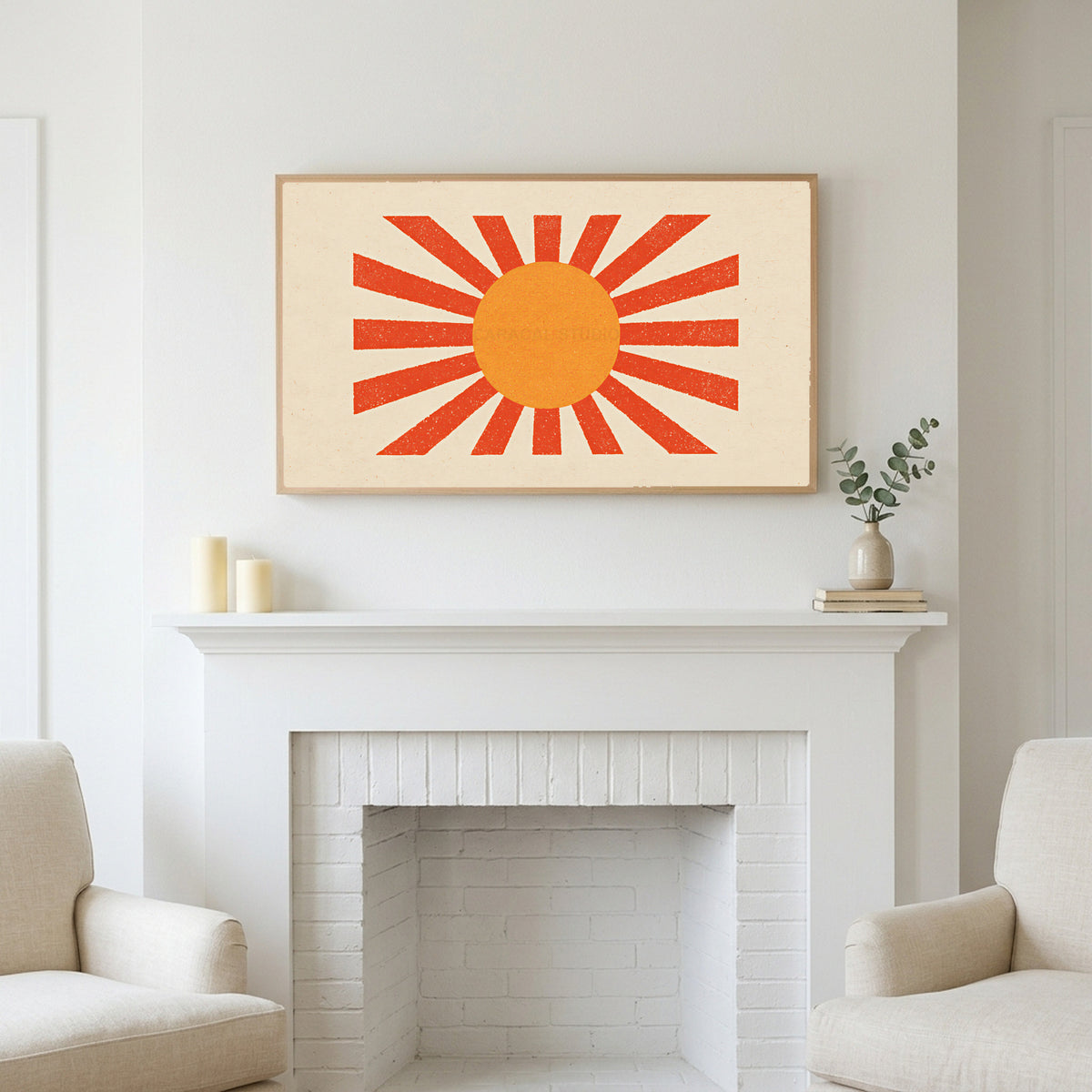 Retro sunburst art above a white fireplace with candles and eucalyptus on the mantel