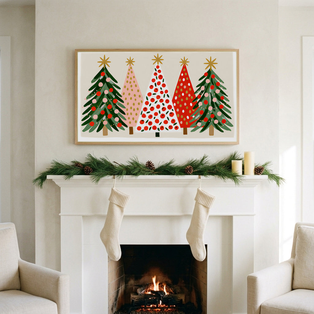 Christmas tree row art on a TV above a white fireplace with a pine garland and cream stockings
