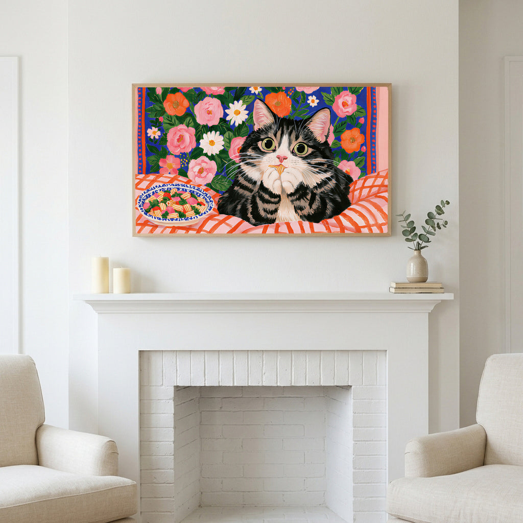 Pasta cat art above a white fireplace with candles and eucalyptus on the mantel